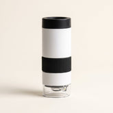 Curio Pocket Microscope on a plain studio background